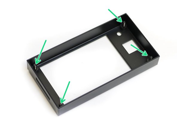 Begin by taking the touch screen case and insert four M3 x 12mm bolts through the four holes shown.