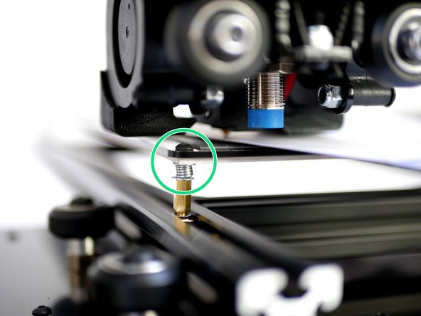 Use a folded piece of paper to feel the gap between the nozzle and print surface.