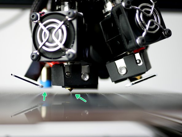 Lower the gantry by hand so that the nozzle comes close to the print surface. Once close enough the red light on the probe should come on.