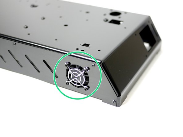 Orient the fan so that the sticker side faces inwards and the cable points to the roof of the base.