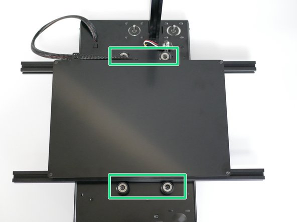 Slide the Platform assembly in between the four rollers on the base.