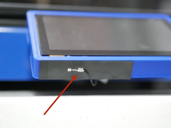 After installing the display fix the WiFi antenna to the case.