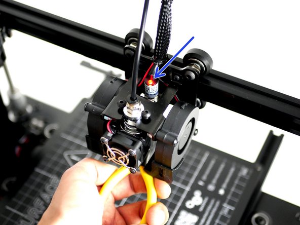 Whilst holding a metal object under the probe (a red light should shine) send the M119 command.