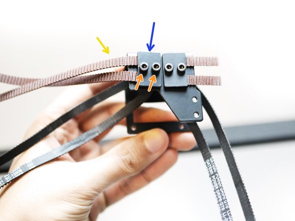Loop the lengths of belt around, making sure to keep them from getting twisted. The inside of the loop should be the toothed side of the belt. Feed the other end into the corresponding slot on the other side of the tool carriage.