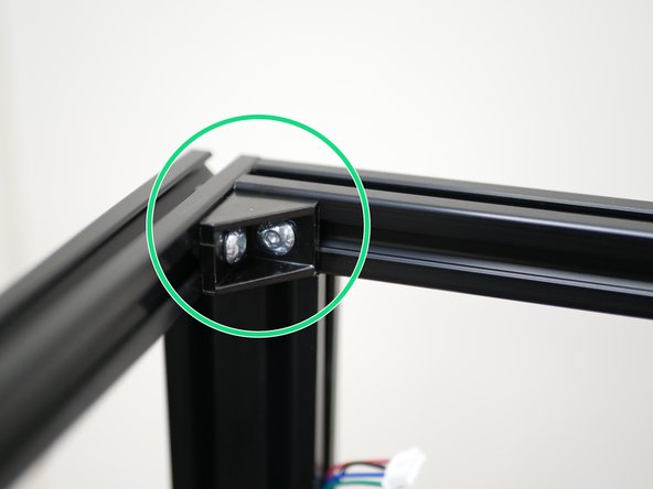 Securely fix the brackets to the internal corners of the printer.