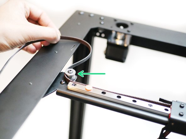 Take the upper belt and begin by wrapping the smooth side around the left idler on the gantry.