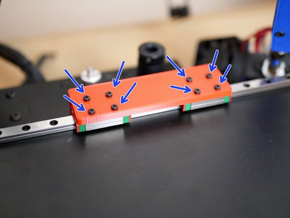 Next line up the linear rail carriages on the platform with the holes on the 3d printed brackets.