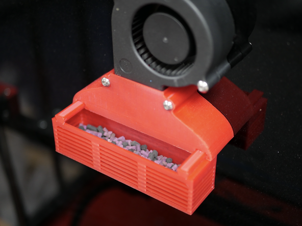 Fill the fume filter tray with the included carbon pellets and slide it onto the housing.