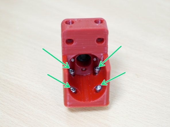 Drop four M3 x 10mm bolts into a Z-carriage as shown.