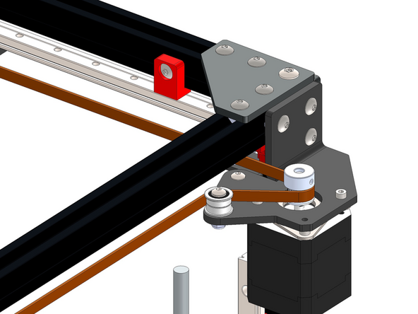Next feed it around the pulley on the rear right motor's pulley and idler.