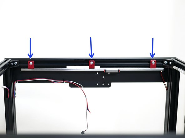 Mount both of the rail assemblies to the side extrusions of the frame as shown.