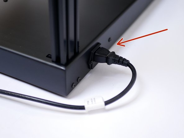 Plug the power cable into the back of the printer.