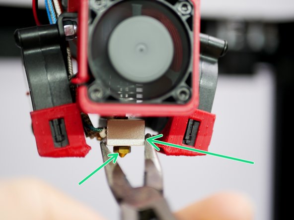 With the hotend hot, hot tighten the nozzle.