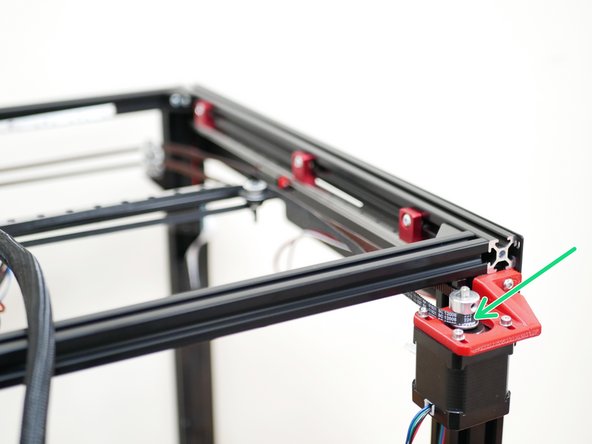 From the front idlers loop the belt around the pulley on the rear motor.