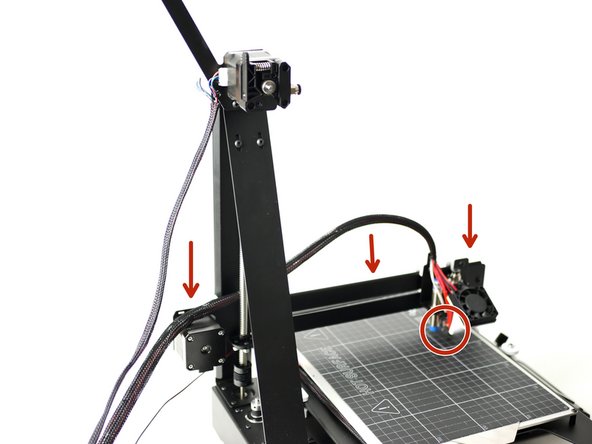 Turn the lead screw to bring the gantry all of the way down, the hotend should be touching the print surface.