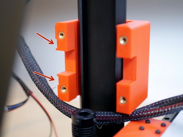 Note the orientation of the carriage. The side with the small insets should point towards the rear of the printer.