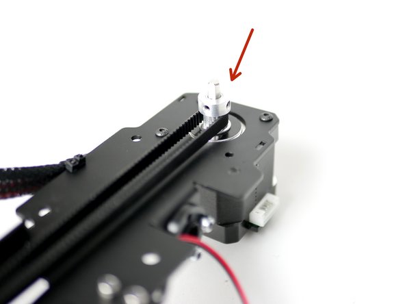 Rotate the pulley by hand to move the print head.