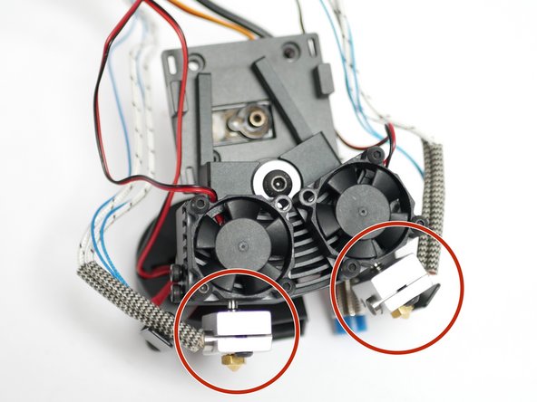 Take the two heater block assemblies from the previous step and push them into the heatsink.