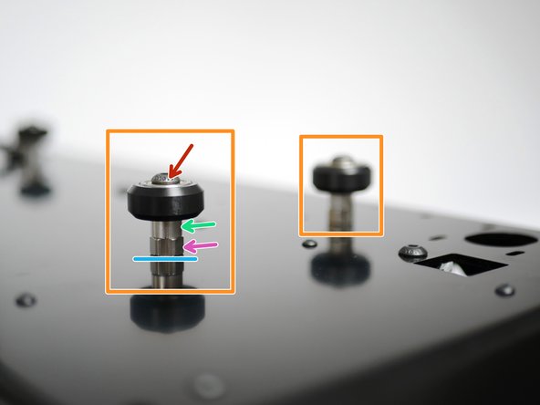 Install two roller wheels at the front of the base. Fix loosely with eccentric spacers and M5 washers: