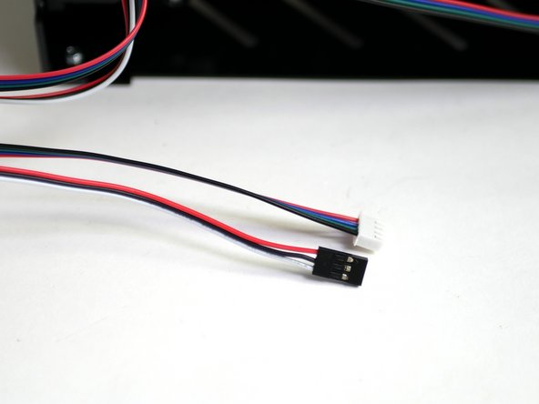 Find the Extruder motor cable and filament sensor cable.