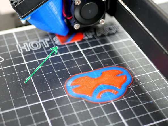 Once printing begins you will notice that when the Axis goes to switch extruders it will draw a square towards the back of the platform, this is the prime tower.