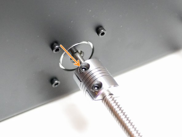 Secure the set screw onto the flat side of the shaft.