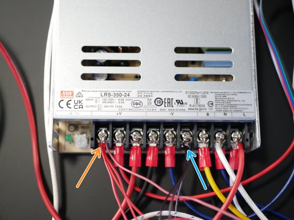 Use scissors or side cutters to remove the two connectors and expose some wire.