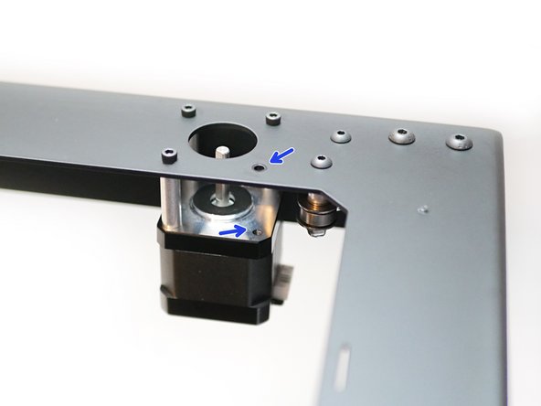 Remove these two bolts and spacers on the motors as shown.