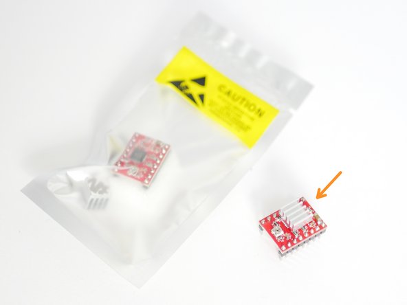 Prepare two of the A4988 Stepper Drivers by removing them from their packaging and sticking the heatsink to the black chip.