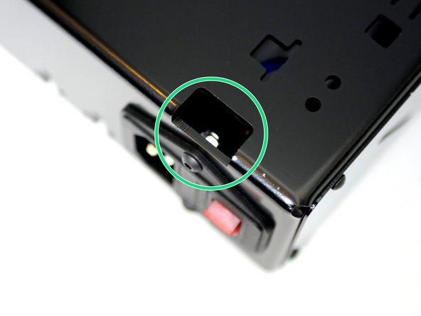 Use the hole in the top of the base to gain access to the top M4 Nut to hold with the pliers.