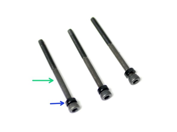 Take three M3 x 40mm bolts and slide onto each of them an M3x2mm spacer.