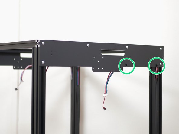 Re-attach the motor and endstop cables to the side panels using cable ties.