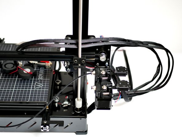 Remove all of the cable ties from the main branch of cables going down to the base.