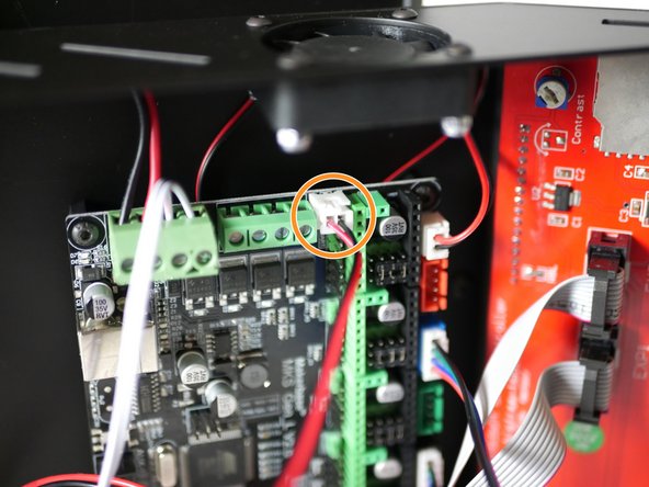 Plug the part cooling fan cable into the control board like shown.