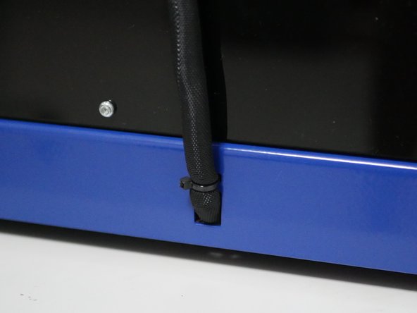 Finally feed the cable loom into the rear of the base and secure with a cable tie.