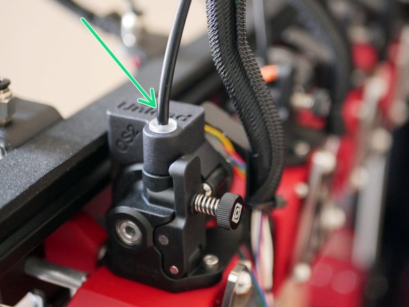 To fix the tubing to the Orbiter extruder the orange clip needs to first be removed, the PTFE tube inserted and then the orange clip be pushed back on to hold it in place.