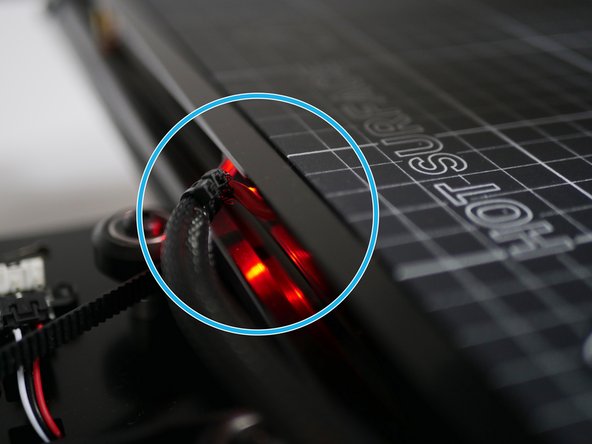 Power on the bed by setting its temperature to 60C - typical for PLA printing.