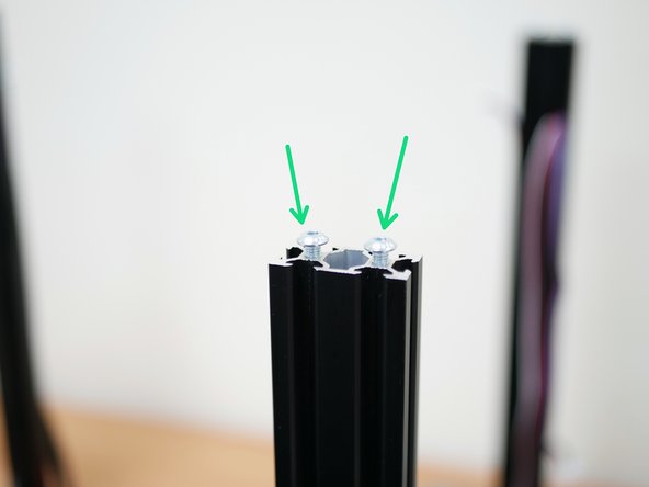 Thread onto the extrusions the included longer M5 x 16mm bolts.