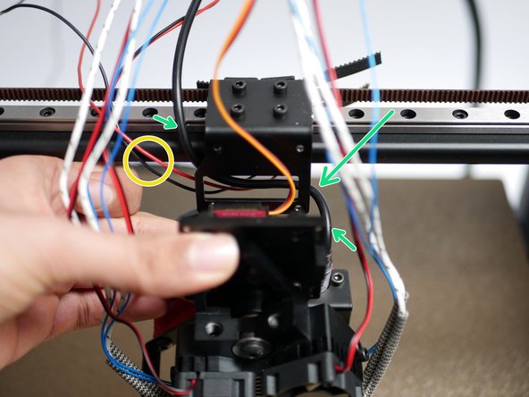 Bring the X-Endstop cable around to the front of the gantry.