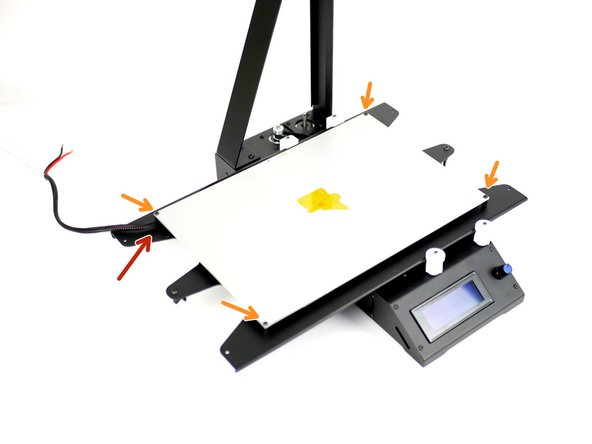 Mount the heated bed, artwork side down, like shown.