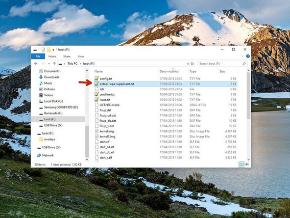 Navigate to the flashed SD card (you may have to remove and reinsert it) and open the file named octopi-wpa-supplicant.txt with Notepad++ or Atom.