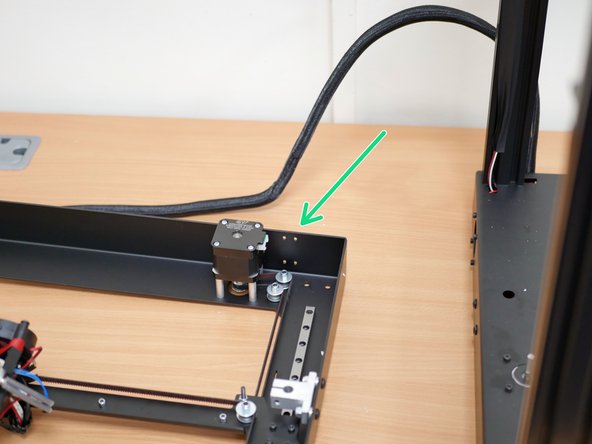 Break the cable ties holding the wiring loom to the rear of the top panel.