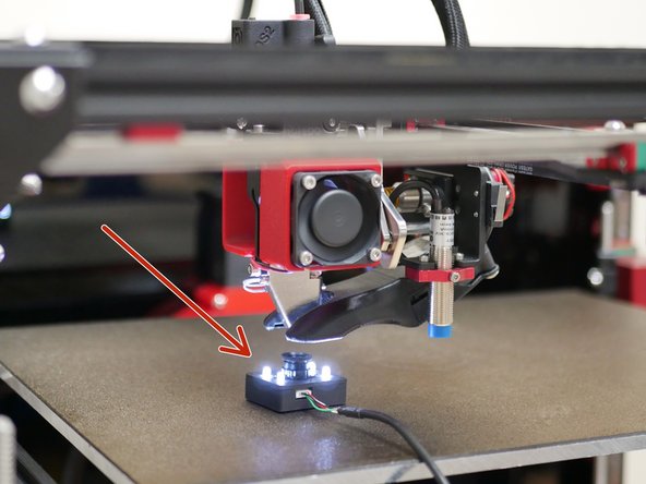 Place the camera module onto the platform - the module has a magnet underneath it which will stick to the platform.