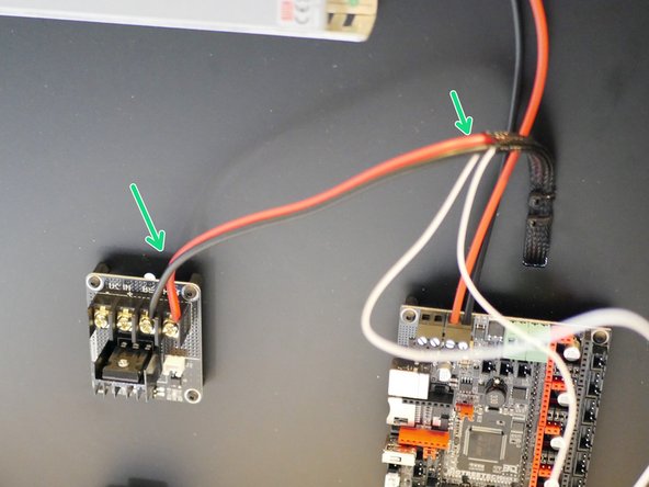 Secure the power cables from the heated bed onto the MOSFET as show.