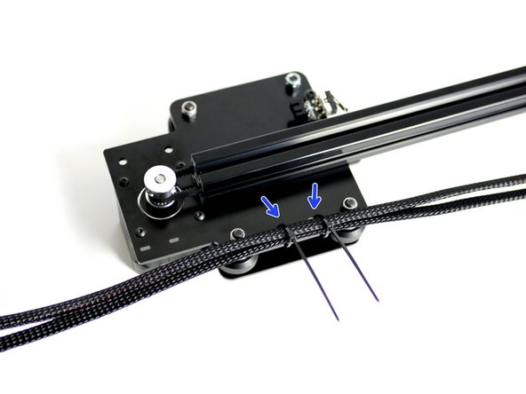 Push two cable ties into the Z-Axis Bracket holes as shown and secure the cables to it.