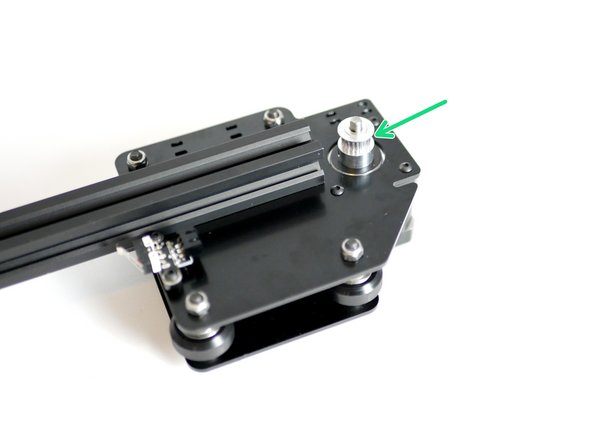 Slide onto the Shaft of the Y-Motor a Pulley. Do not tighten yet.