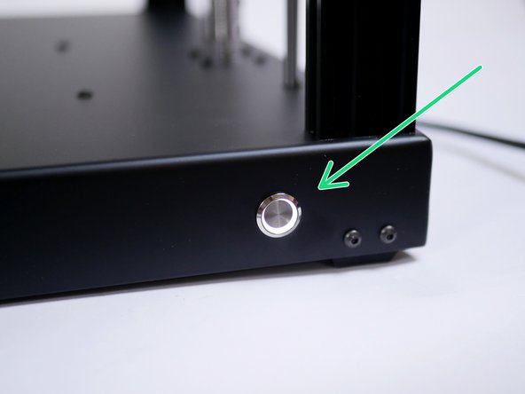 Power on with the switch on the front of the base.