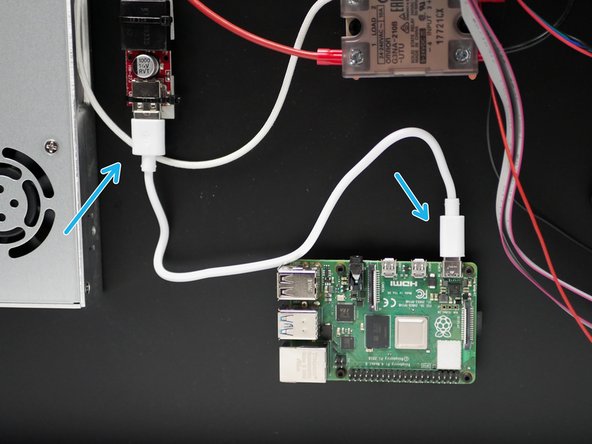 Connect the USB power cable from the adapter to the Raspberry Pi board.