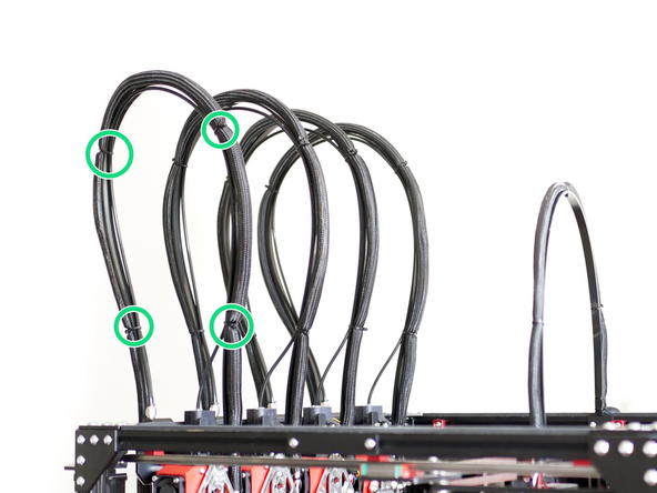 The wider side of the cable support fixes onto the bracket on the side of the frame of the printer.