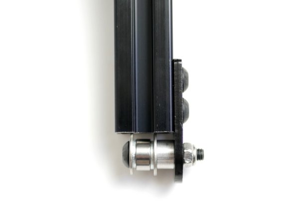 Make sure that the large washers are pressing against the end of the beam.